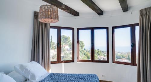 Katil atau katil-katil dalam bilik di Mijas Residence