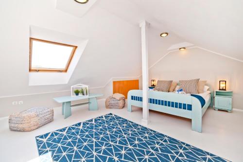 Ένα ή περισσότερα κρεβάτια σε δωμάτιο στο BlueApart Apartamenty Jurata
