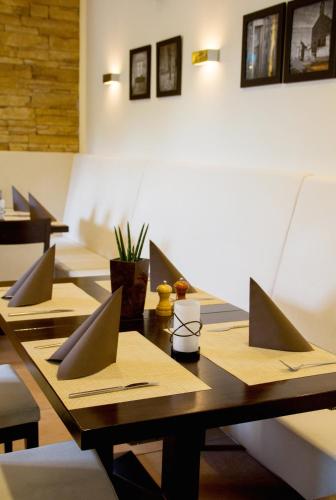 a group of tables with laptops on top of them at Konoba in Meckenheim