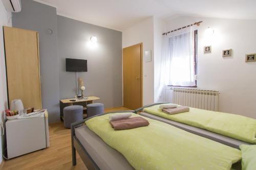 Postel nebo postele na pokoji v ubytování Guest House Stari