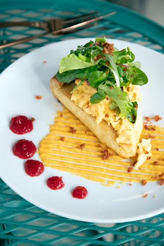 a white plate with a piece of fish with greens on it at 14 Reasons Why Hotel Athens in Athens