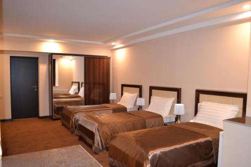Postel nebo postele na pokoji v ubytování Pamir Palace