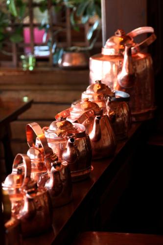 a group of jars of food sitting on a table at Green Hotel in Tällberg