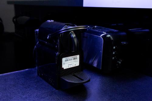 a black toaster is sitting on a table at Apartmani Pezerović in Soko Banja