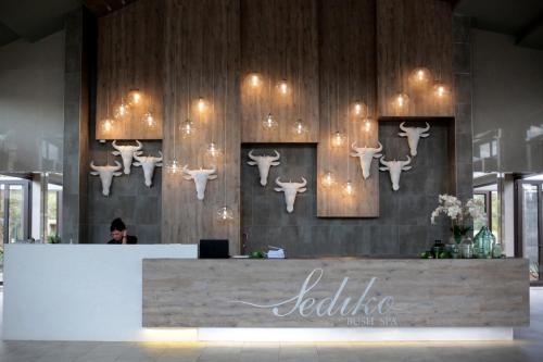 a lobby with a counter with deer heads on the wall at Palala Boutique Game Lodge and Spa in Tom Burke