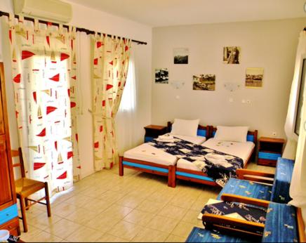 a bedroom with two beds in a room at Studios Elina in Skala Potamias