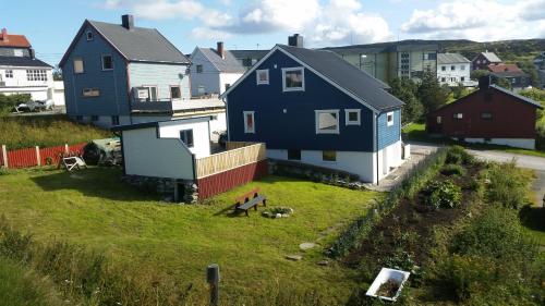 an aerial view of a house with a yard at Blue House II at the end of the World in Mehamn