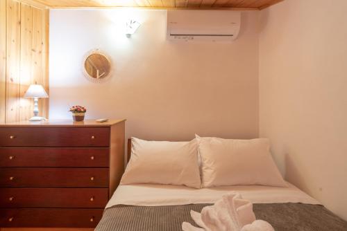Ένα ή περισσότερα κρεβάτια σε δωμάτιο στο Vilkas Home