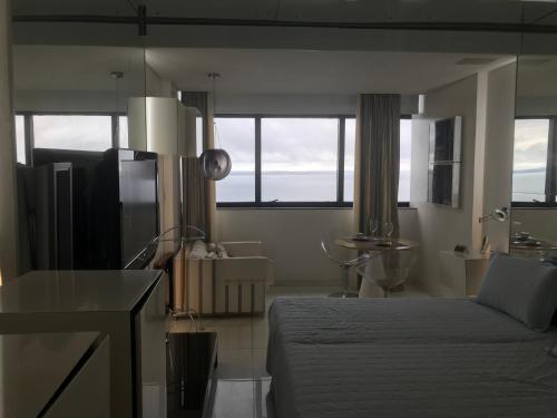 Khu vực ghế ngồi tại Flat Privativo Sol Victoria Marina