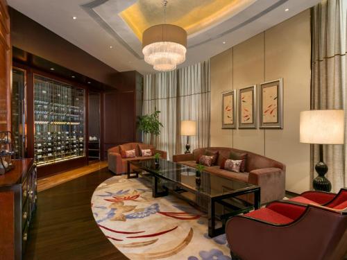 a living room with a couch and a table at Kempinski Hotel Xiamen in Xiamen