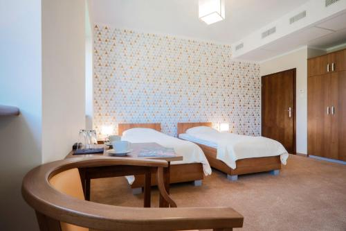 מיטה או מיטות בחדר ב-Hotel Aviator