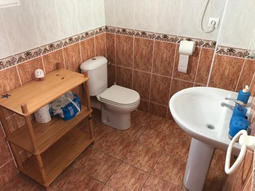 a bathroom with a toilet and a sink at Ferienhaus SUNSHINE Torrevieja/Spanien in Orihuela Costa