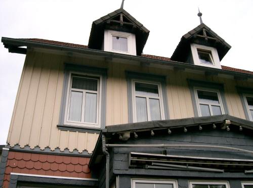 a house with three windows on top of it at Pension Haus Martha in Bad Grund
