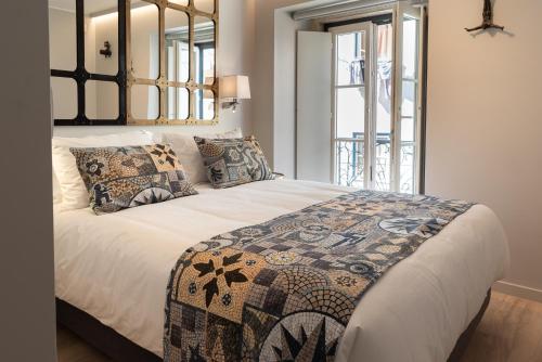 Sitio dos Cavaleiros Apartments tesisinde bir odada yatak veya yataklar