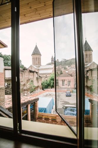 a view from a window of a church at Mariam R in Tbilisi City