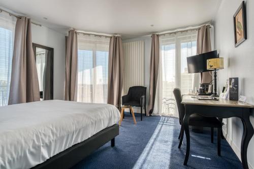 Katil atau katil-katil dalam bilik di Hotel Le Berry Saint-Nazaire
