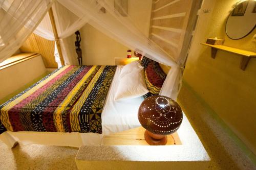 En eller flere senge i et værelse på B & B Teranga Warang