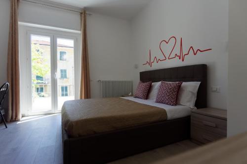 Postel nebo postele na pokoji v ubytování Le Coccole