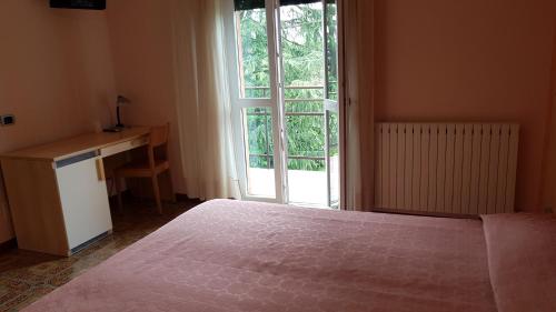 Postel nebo postele na pokoji v ubytování La Collina
