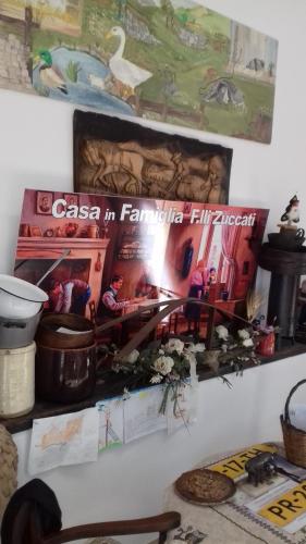 a magazine on a wall with a picture of a train at Villa Glori affitto camere monolocali in Carpi