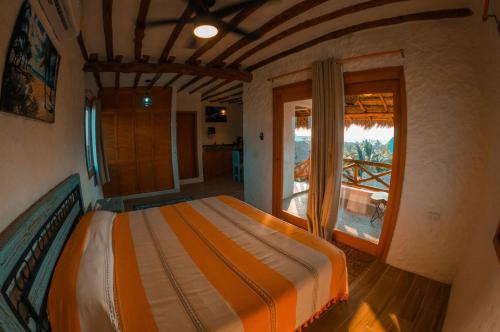 Postel nebo postele na pokoji v ubytování Ensueño Holbox & Beach Club