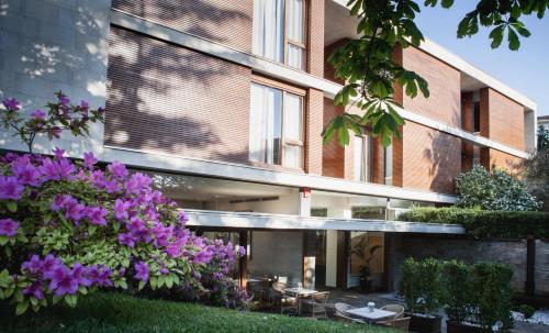 a building with purple flowers in front of it at Hotel Jaizkibel in Hondarribia