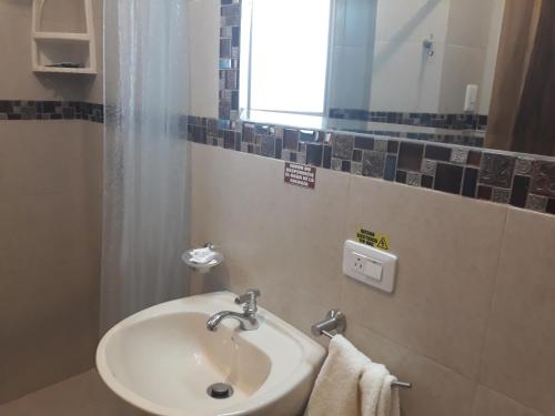 A bathroom at Hotel Almond Beach