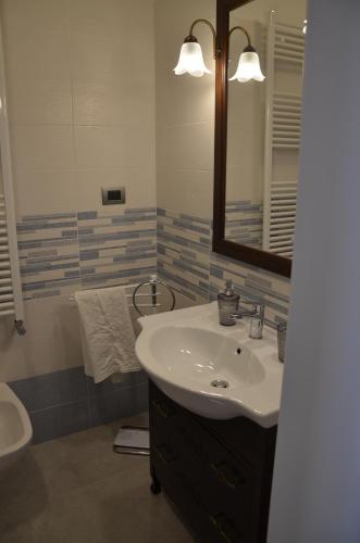 a bathroom with a sink and a mirror at Il Borgo Antico in Bisceglie