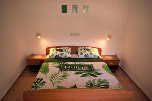 A bed or beds in a room at Romantic Apartment In Nature