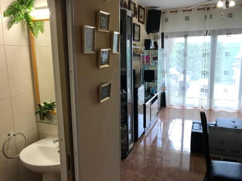 a bathroom with a sink and a toilet in a room at Holiday Home Bungamar in Playa de las Americas