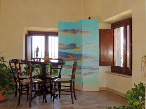 a dining room with a table and some chairs at Hotel Il Cavalier D'Arpino in Arpino
