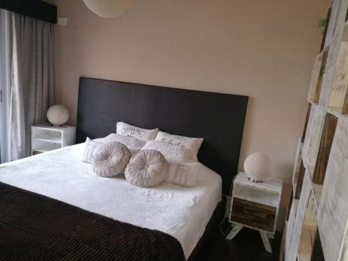 Łóżko lub łóżka w pokoju w obiekcie Petit Lacroze