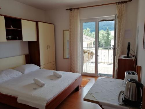 Ένα ή περισσότερα κρεβάτια σε δωμάτιο στο Apartments Emmas studio