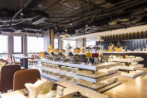 a restaurant with a buffet of food on display at Stella Maris Beach Danang in Da Nang