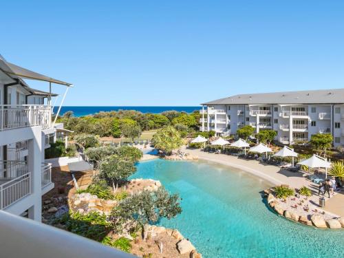 an aerial view of the pool at the resort at Salt Beach Resort Suites by Kingscliff Accommodation in Kingscliff