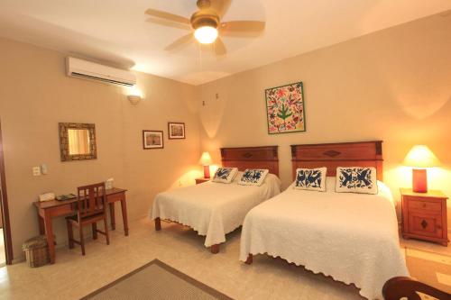 Casa Quetzal Hotelにあるベッド