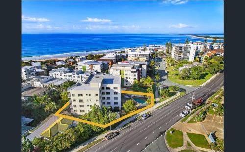 an aerial view of a city with the ocean at Kings Beach Retreat in Caloundra