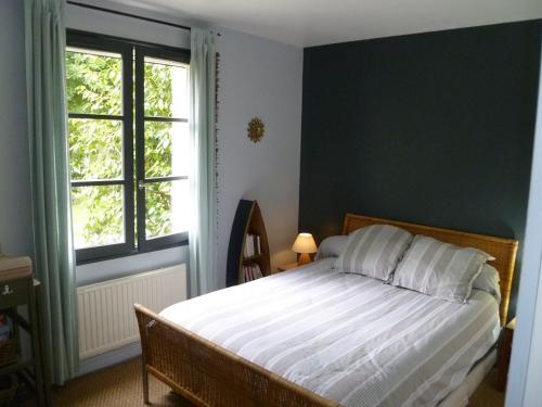 מיטה או מיטות בחדר ב-Villa aux portes du Médoc