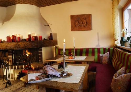 a living room with a couch and a fireplace at Sportalm in Sölden