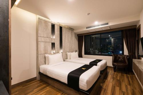 Postel nebo postele na pokoji v ubytování Acqua Hotel