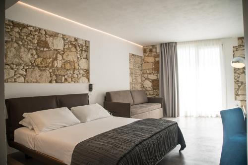 Ένα ή περισσότερα κρεβάτια σε δωμάτιο στο Re Dionisio Luxury Suites