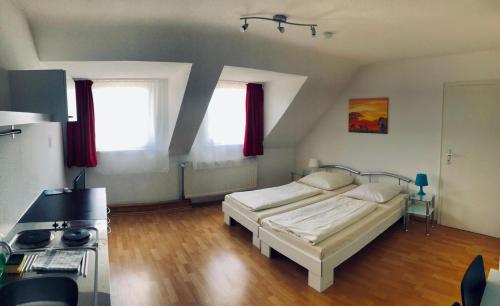 a bedroom with a bed and a stove in it at Hotel Westend in Cologne