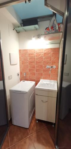 a small bathroom with a toilet and a sink at Luxury Apartment Federica N 1 Centro Storico di Taormina in Taormina