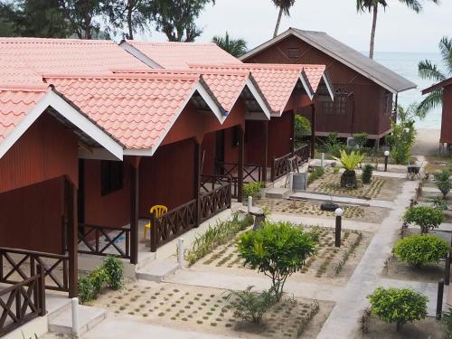 an aerial view of a resort with red roofs at Samudra Beach Chalet in Perhentian Island