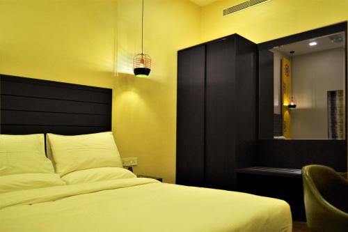 Ένα ή περισσότερα κρεβάτια σε δωμάτιο στο Hotel Asansol International