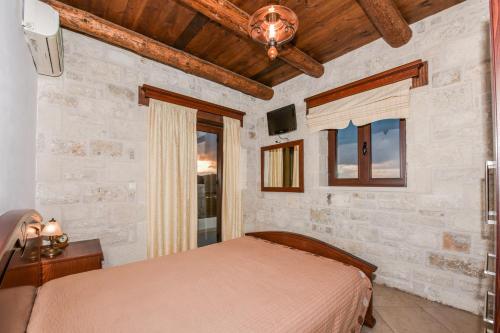 Postel nebo postele na pokoji v ubytování Ariadni Apartments