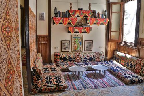 a living room with a couch and a table at Cecilia Hostel in Cairo