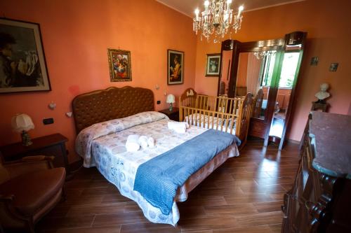 a bedroom with a bed with a crib in it at Villa Giacomina in Fasano
