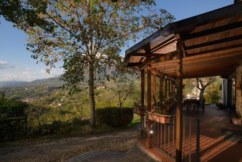 a porch of a house with a view of the mountains at Agriturismo Colle Tocci in Subiaco