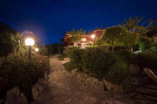 a street light in front of a house at night at Villa Giacomina in Fasano